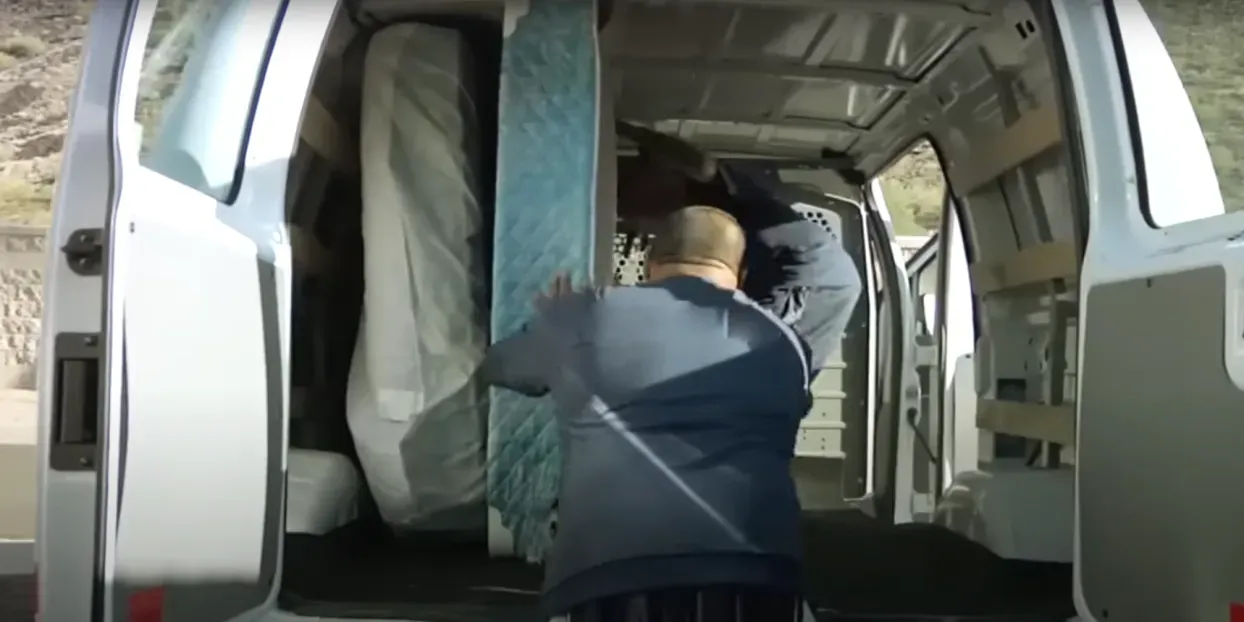 Professional movers carrying boxes